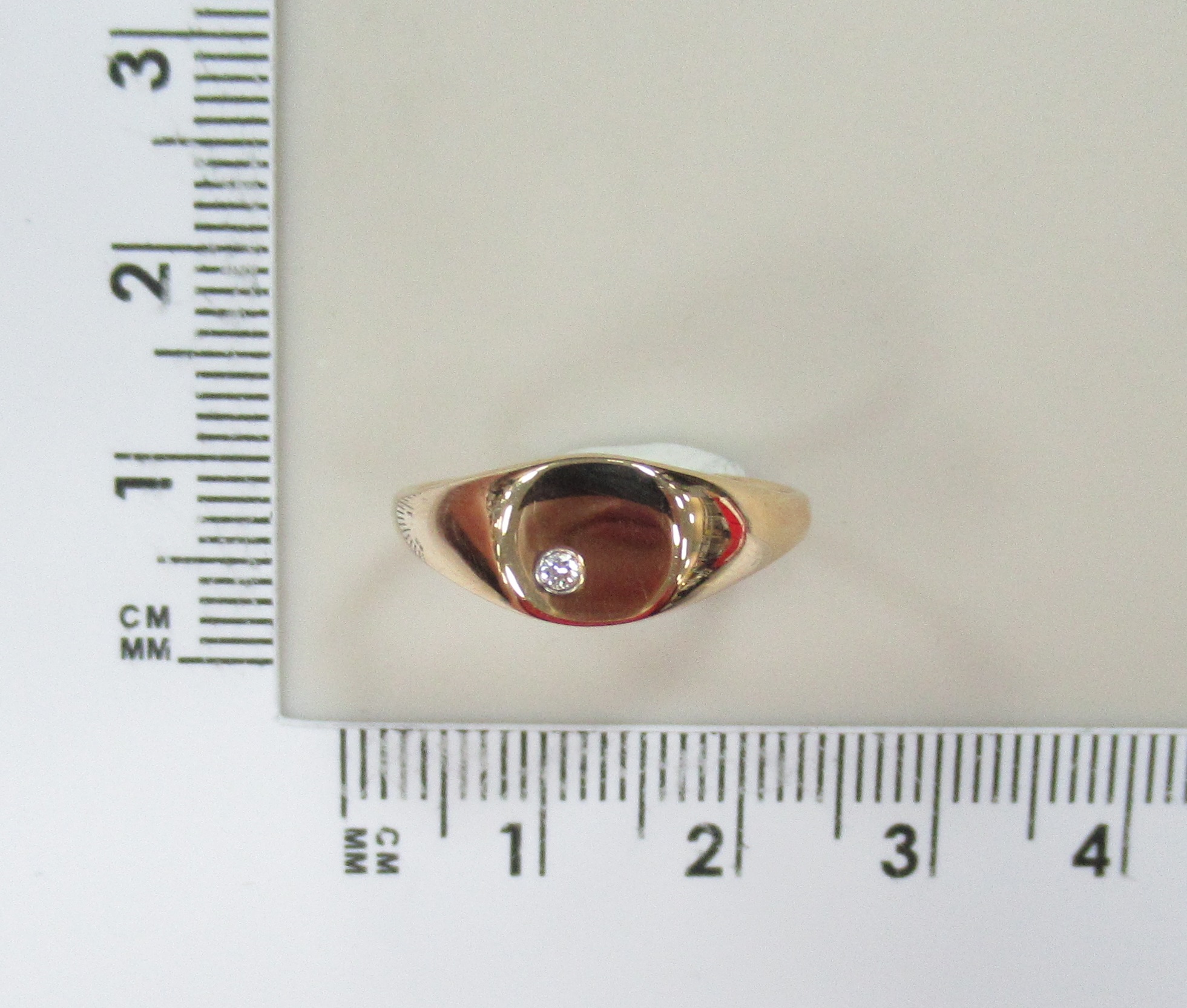 Золотое кольцо 585 пробы; родий; вставки 1 Бр.Кр-57 0,015 4/5А;